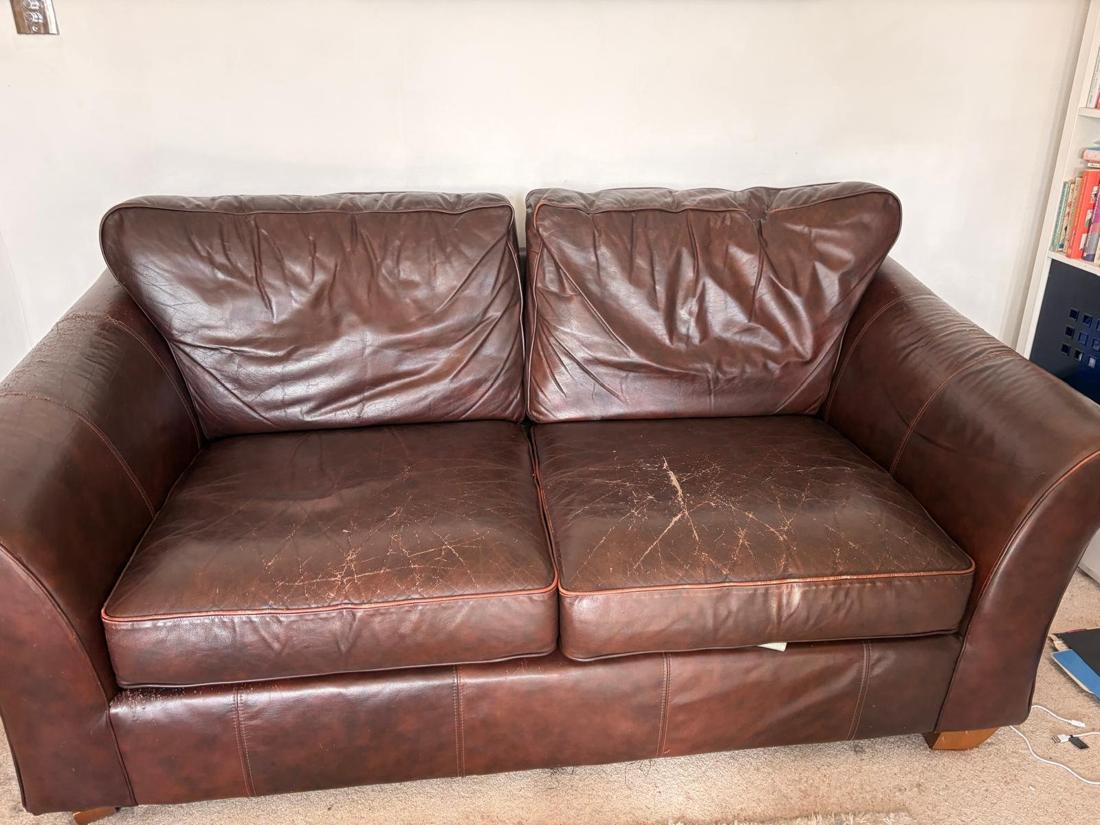Brown leather sofa ready for removal
