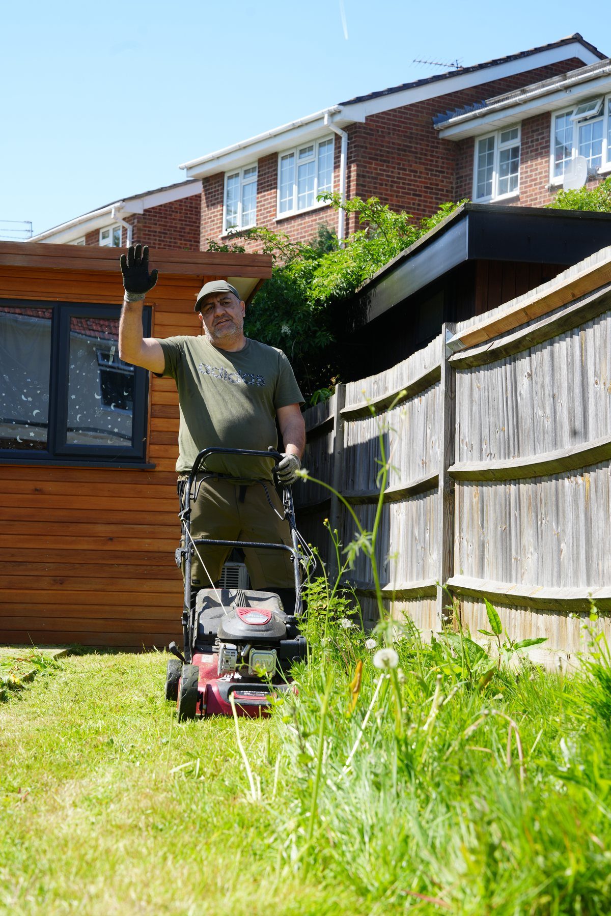 Turnbright gardener mowing a lawn