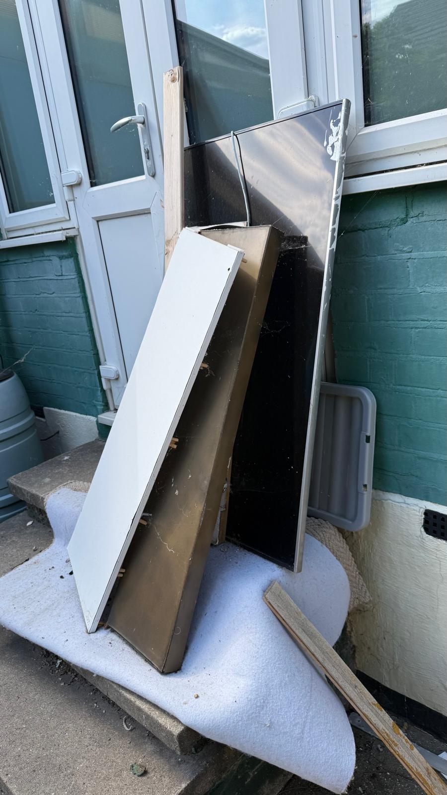 Dismantled household units prepared for removal