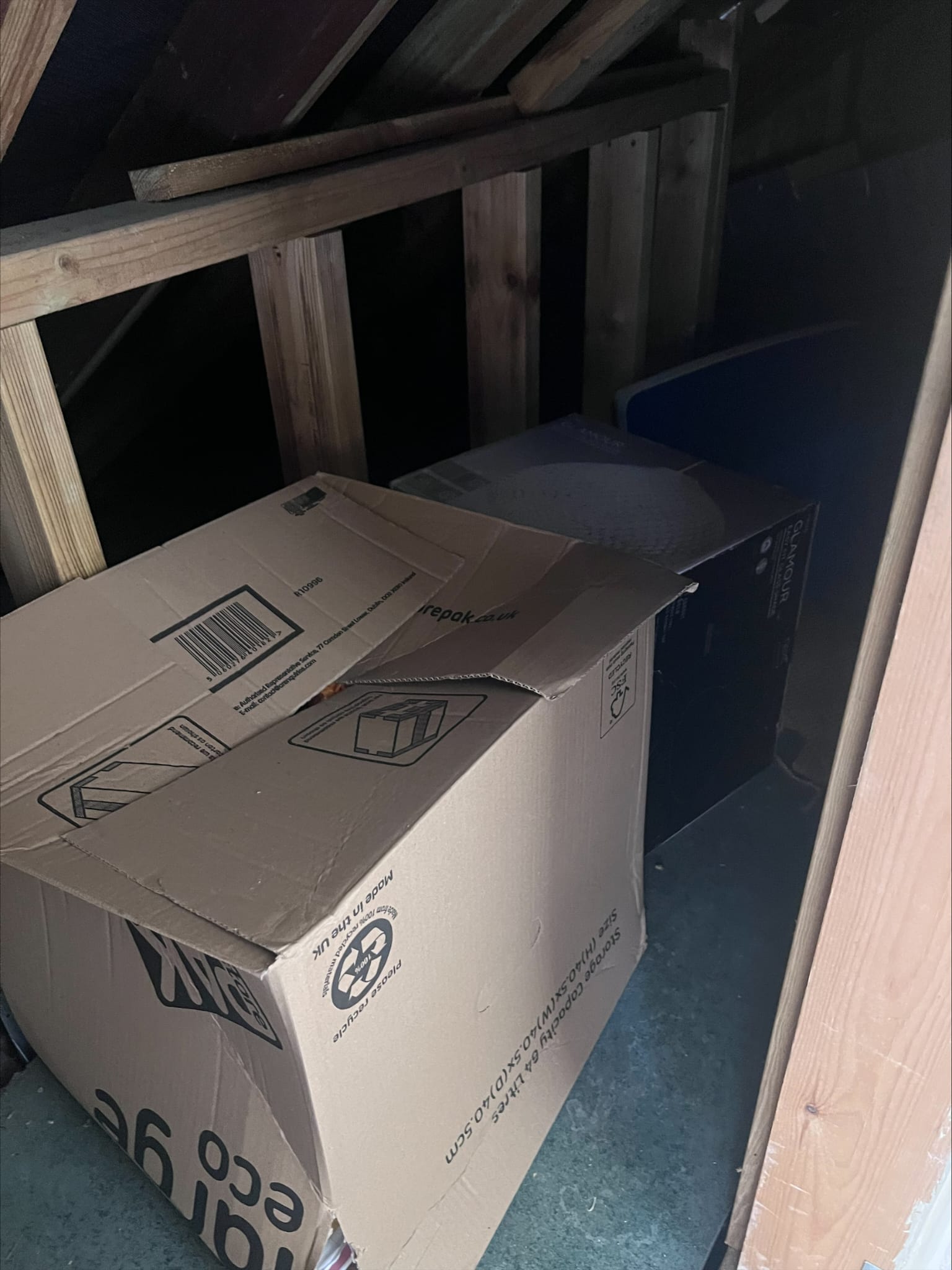 Boxes and stored household items ready to be removed from a loft